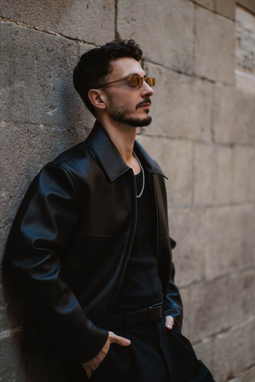 Michael in profile against a stone wall